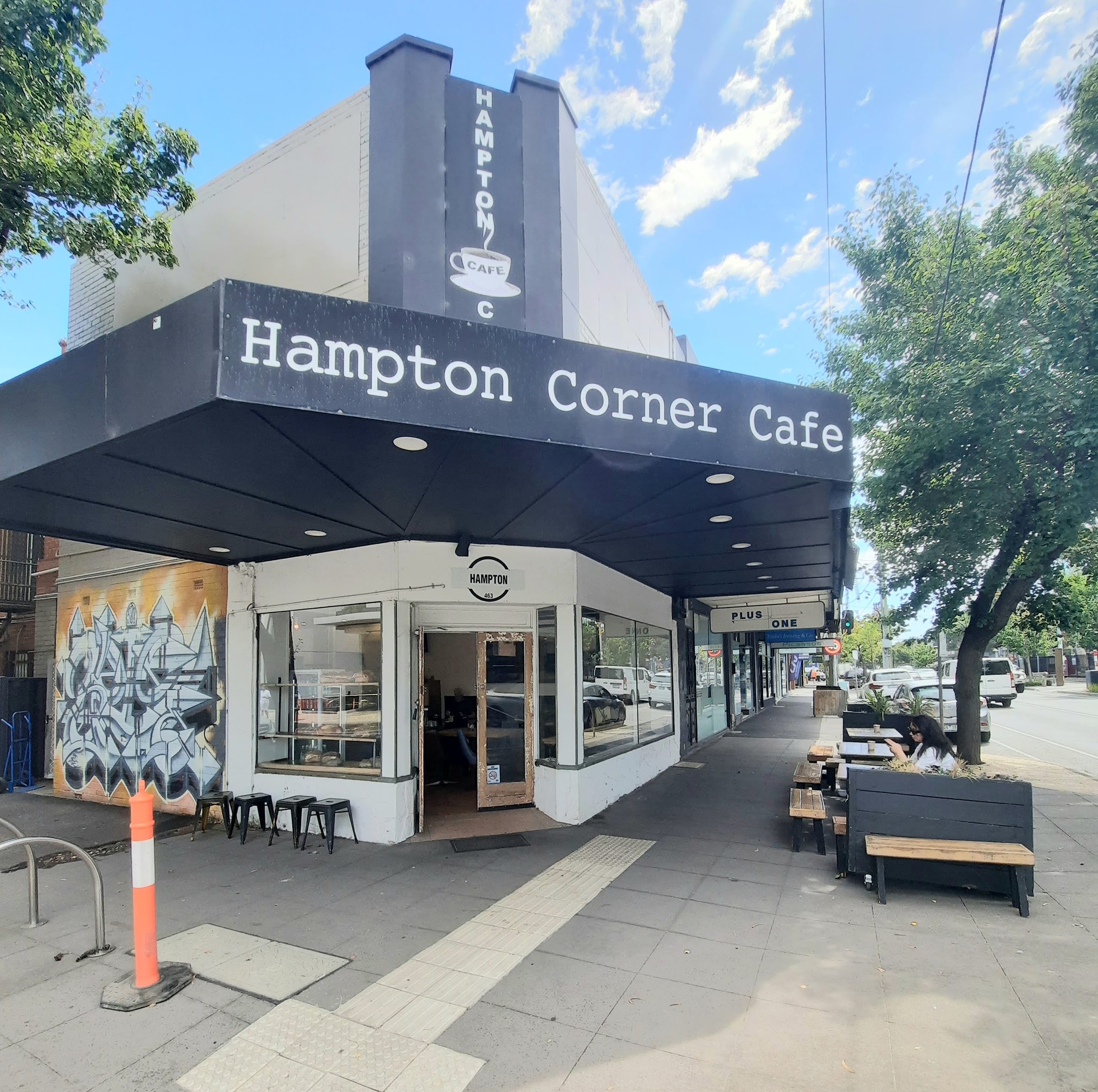 Our shopfront under the black Hampton Corner Cafe awning
